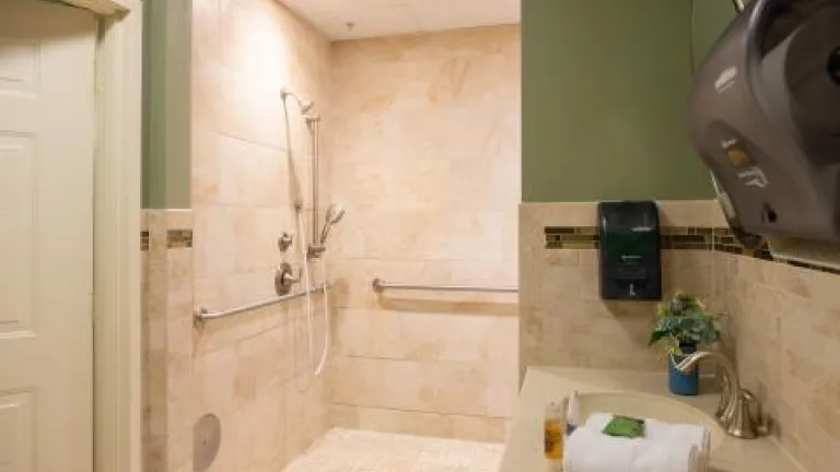 A spacious, tiled walk-in shower in the Spa Room at Kingsway Manor