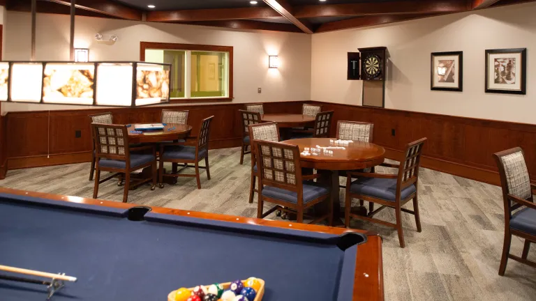 Interior photo of a game room at Kingsway, a pool table can be seen at the bottom edge of the photo.