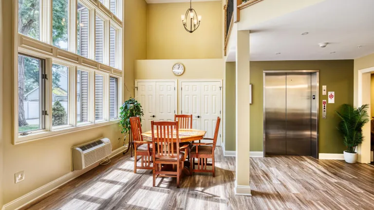 A large open living space with lots of natural light coming in. 