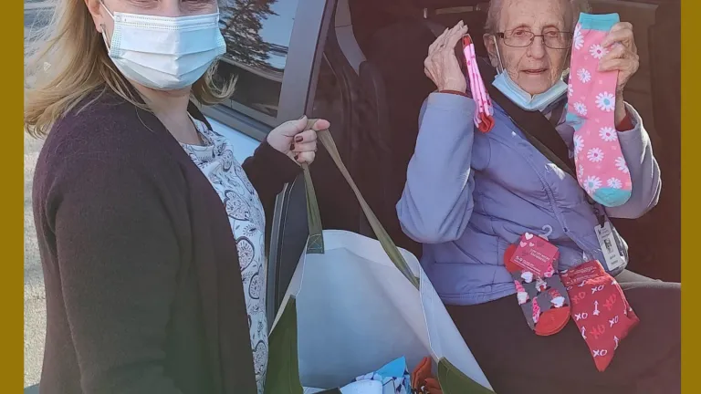 Resident with a collection of donated socks