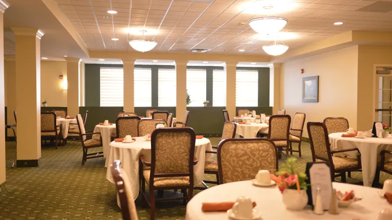 Saratoga Dining Room, many round dining tables can be seen with their places set