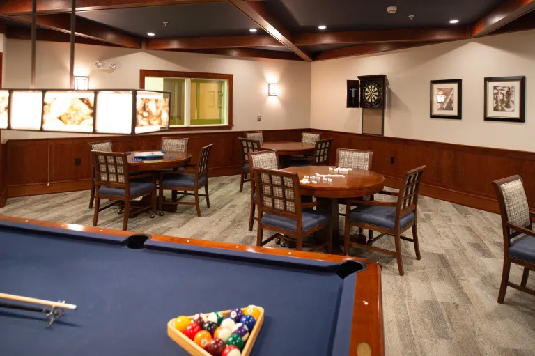 Interior photo of a game room at Kingsway, a pool table can be seen at the bottom edge of the photo.