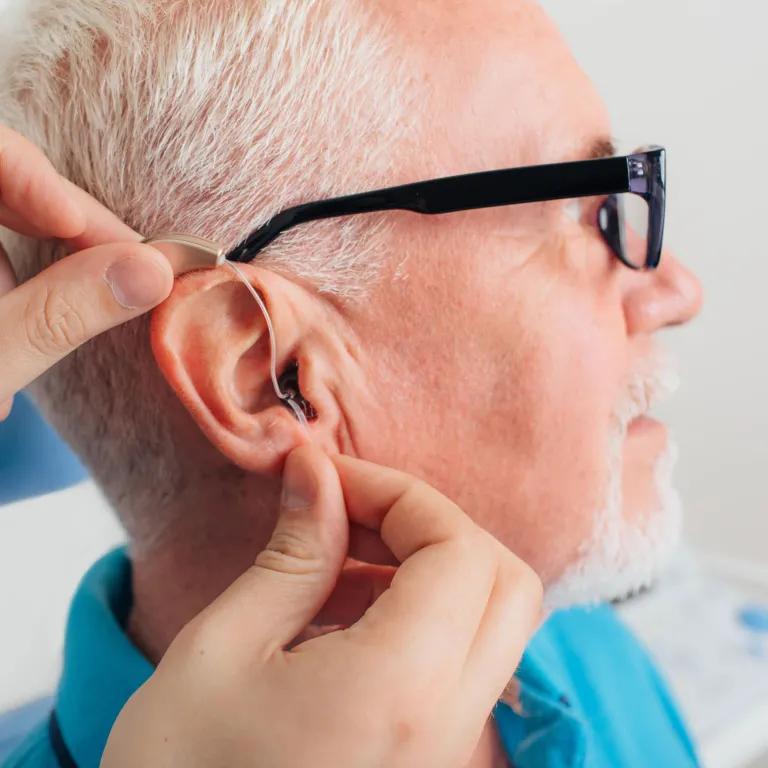 Patient being measured for a hearing aid