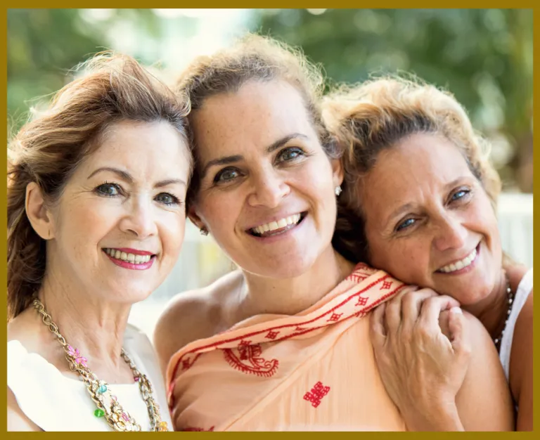 Group of three sisters smiling